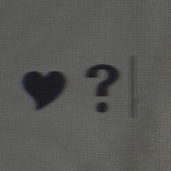 a black heart followed by a question mark, typed onto a computer document